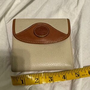 Dooney & Bourke Cream Leather Bifold Wallet with Brown Trim